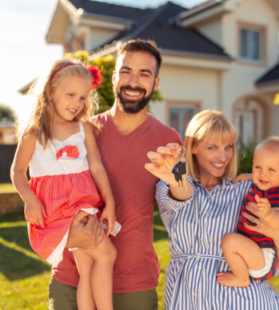 family-holding-keys-after-buying-house-2022-04-25-13-59-14-utc-scaled.jpg
